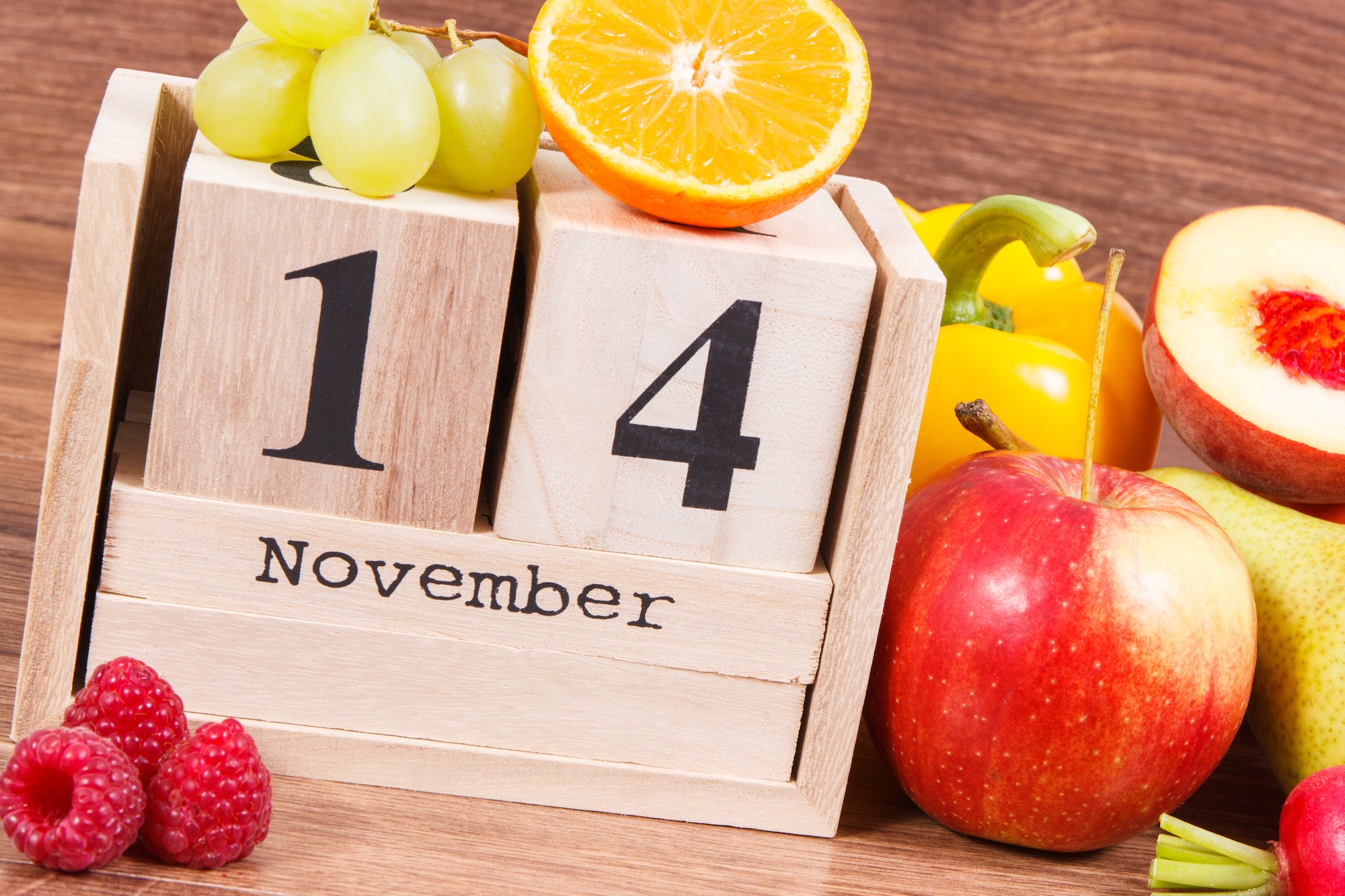 Date of 14 November on calendar and fruits with vegetables, world diabetes day concept